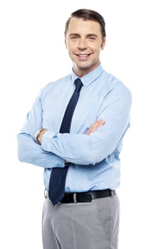 Smiling business representative posing, arms folded. Isolated against white background