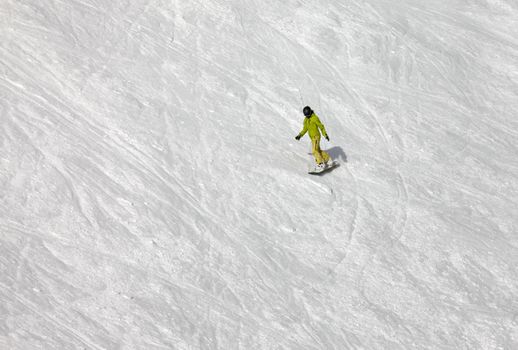 Snowboarder riding fresh powder snow