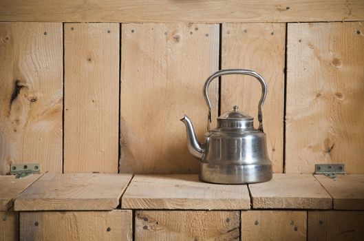 Old classic and vintage teapot on wooden texture