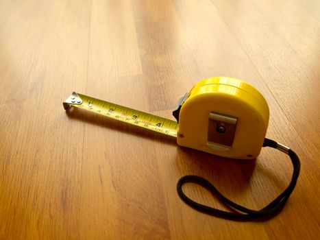 Measuring tape on laminate floor