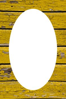 Ancient yellow painted wooden wall with peeling paint background. Isolated white oval place for text photograph image in center of frame.