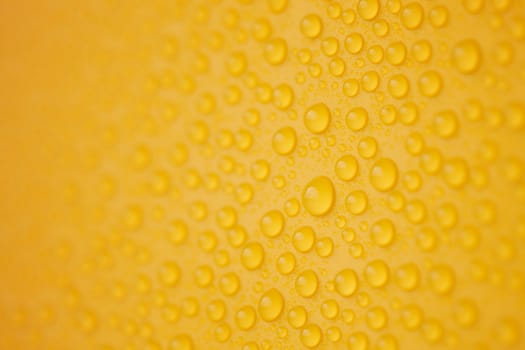 Abstract water-drops on yellow