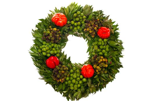 Autumn wreath of pumpkin leaves and berries. Decorating for Halloween.