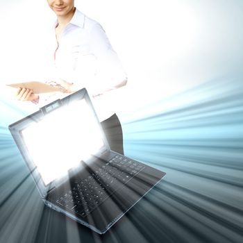 Image of notebook with shining screen and light