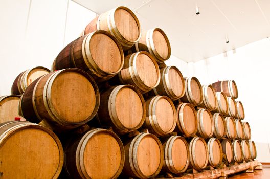 Wine keg barrels stacked keep cool.