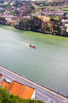 boat floats on the river Douro in Porto, Portugal