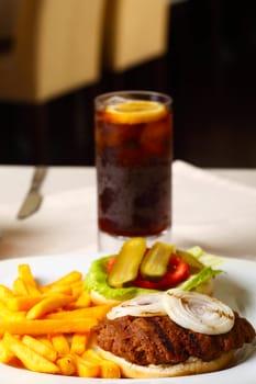 Open hamburger with cola and french fries