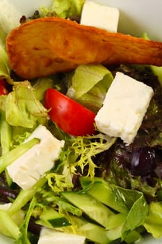 Greek salad with cheese and crispy bread
