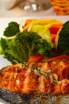 Delicious salmon grilled with brocoli lemon and bread