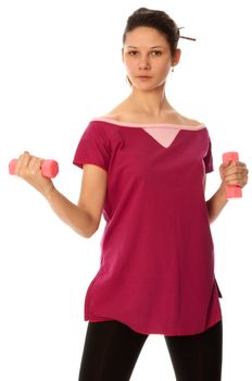 Instructor showing to people exercises using dumbbells at gym