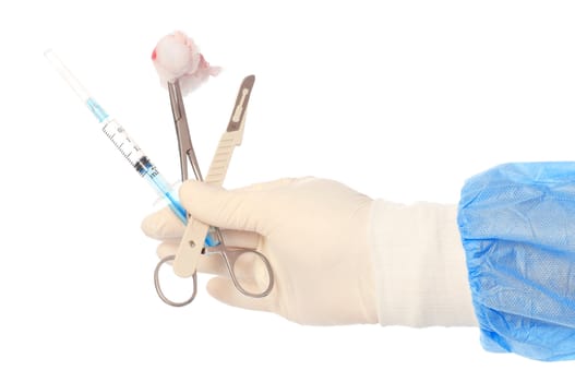 syringe, scalpel and clamp with swab in the hand of the surgeon during a surgery