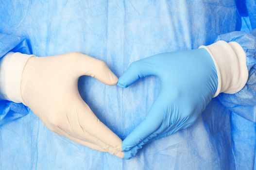 cardiologist in blue and white gloves saving life of all his patients