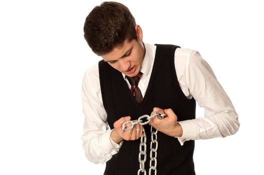 businessman breaking the chain by hands for liberation as a symbol of work captivity