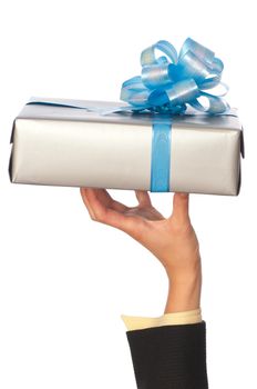 Woman holding a grey box with blue bow as a present