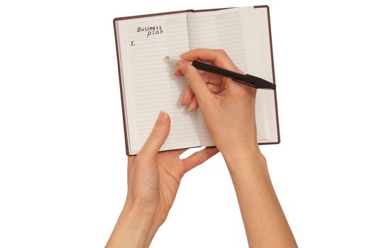 business woman writes ideas for business plan