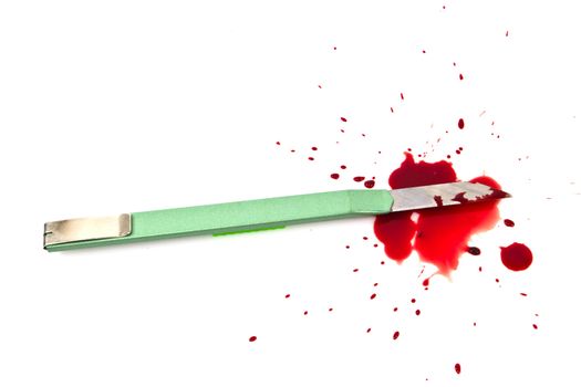 Green cutter knives and blood on white background