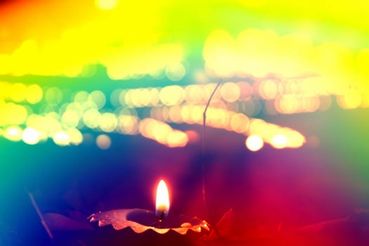 A colorful haze over a traditional lamp lit on the occassion of Diwali festival in India.