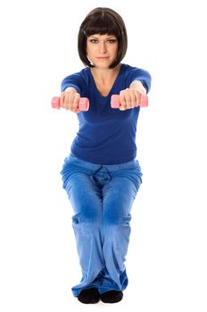 instructor showing to people exercises using dumbbells at gym