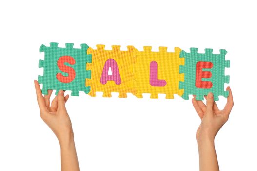 seller holding in the hand signboard signifying the beginning of sales