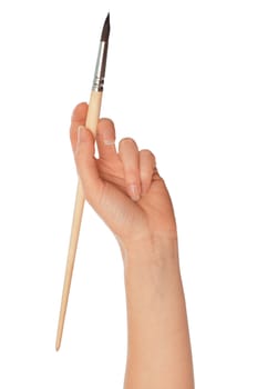 woman drawing a picture with a brush