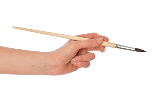 woman drawing a picture with a brush