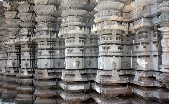 A view of the architecture of the pillars of an ancient Indian temple.