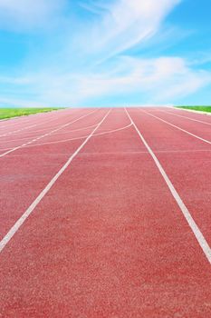 detail of a running track towards the horizon and blue sky