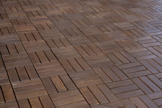 The texture of wooden parquet dark red-brown color