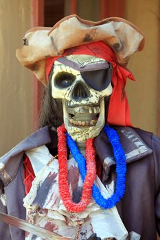 Colorful pirate puppet with a skull face.