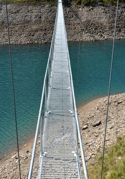 A footbrige over the hydroelectric basin of Morasco, Formazza, Italy