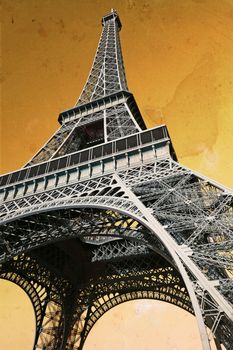 The Eiffel Tower in Paris France, done with vintage feel with old paper background.