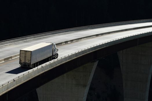 Semi trailer truck crossing a high level bridge in British Columbia, Canada