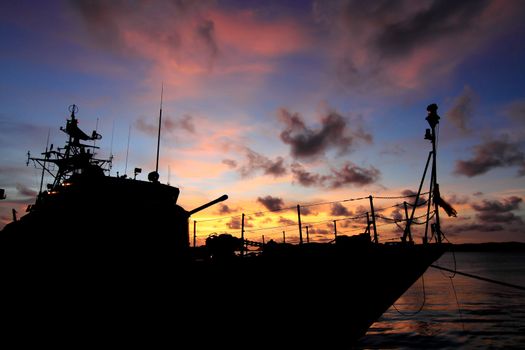 battleship with sunset behind