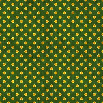 Glowing gold polka dots on deep green textured background. Seamless