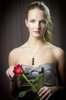 Attractive woman holding a rose on Valentine's day,