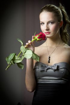 Attractive woman holding a rose on Valentine's day,