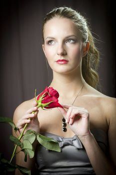 Attractive woman holding a rose on Valentine's day,