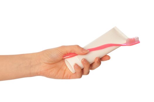 Tooth-paste and brush at in the girl's hand