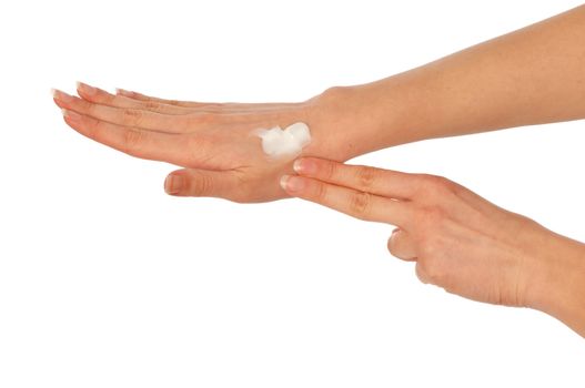 woman lubricates the hands skin with cosmetic cream