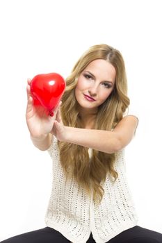 Young woman holding red heart in valentine's day, on white background