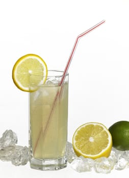 studio photography of a translucent soft drink with sliced lemon and drinking straw in light back with lemon fruits and ice cubes