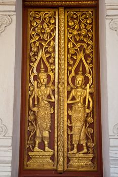 Gate measure of the angels. Wat Luang Lumphun, Thailand.