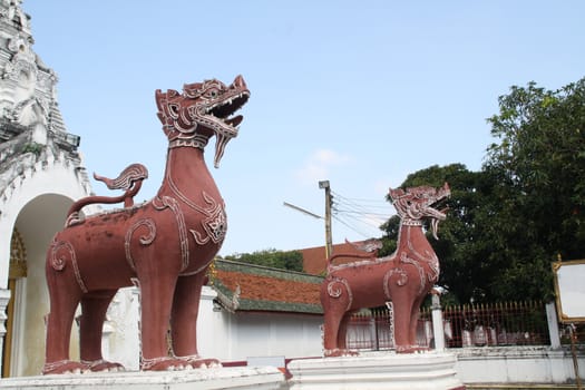 The lion statues. Wat Phra Lamphun, Lamphun, Thailand.