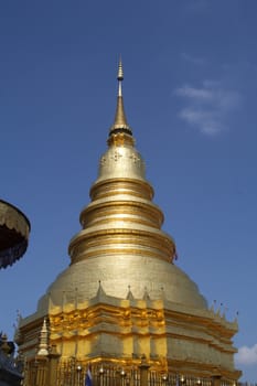 This is a golden pagoda temple in Chiang Mai, Thailand.