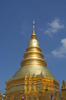 This is a golden pagoda temple in Chiang Mai, Thailand.