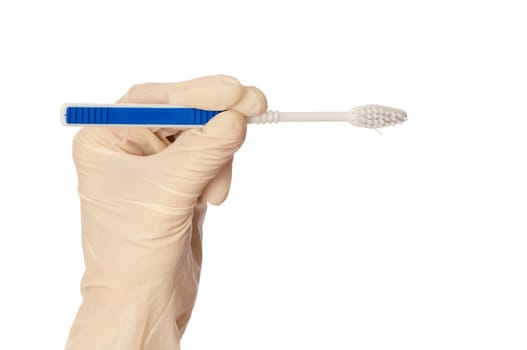 Orthodontist recommends to the patient a suitable toothbrush