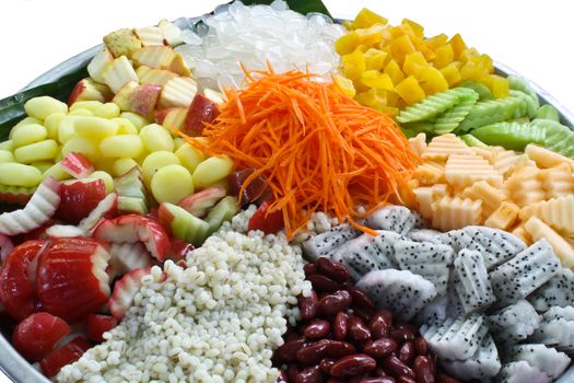 Salads, vegetables, fruit in a dish large pad with banana leaves.