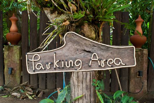 Parking signs are made from a wood-frame rope.