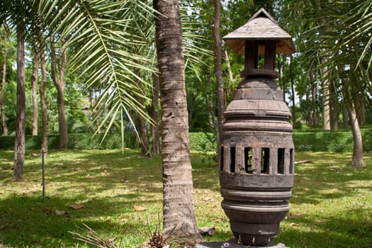 Lamps in the garden are made of wood.