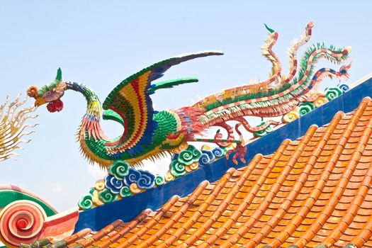 Phoenix statue on blue sky. Sian Temple. Chon Buri, Thailand.